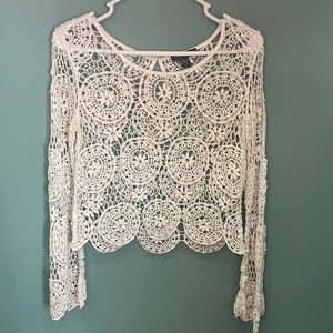 Beautiful lace pattern bell sleeve top by Kendal and Kylie
